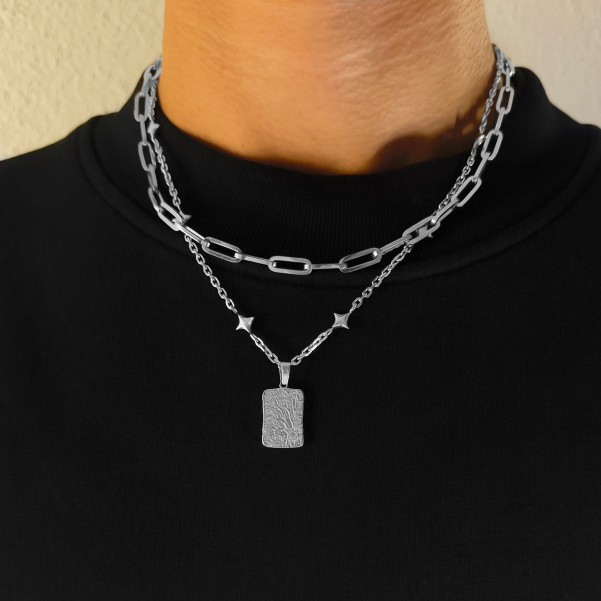 Minimalist silver chain featuring star charm and lava rock pendant
