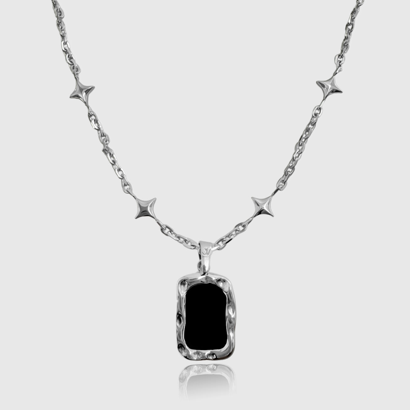 Silver star chain with black onyx pendant – protective gemstone necklace.