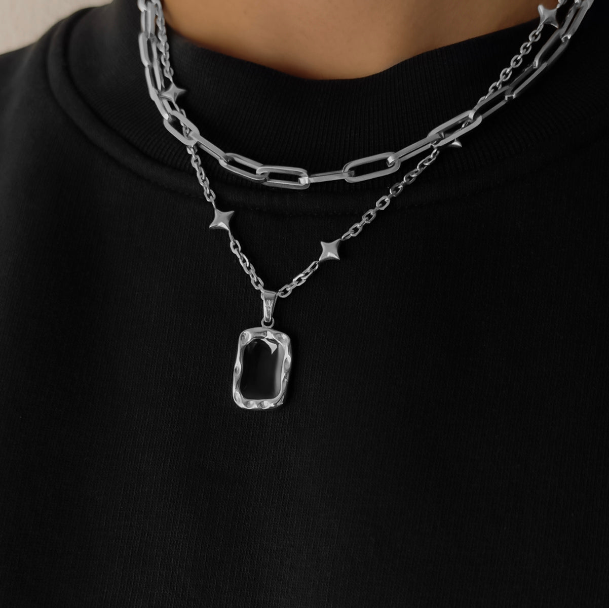 Silver celestial chain featuring natural onyx stone pendant.