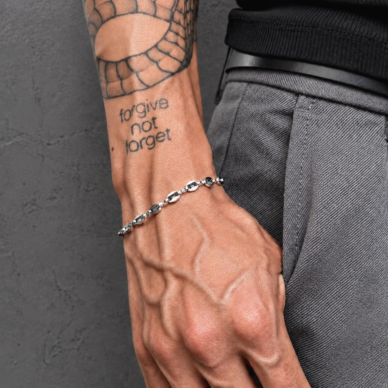 Coffee Bean Bracelet - Silver (5mm) worn on a man's wrist next to a tattoo, showcasing streetwear style.