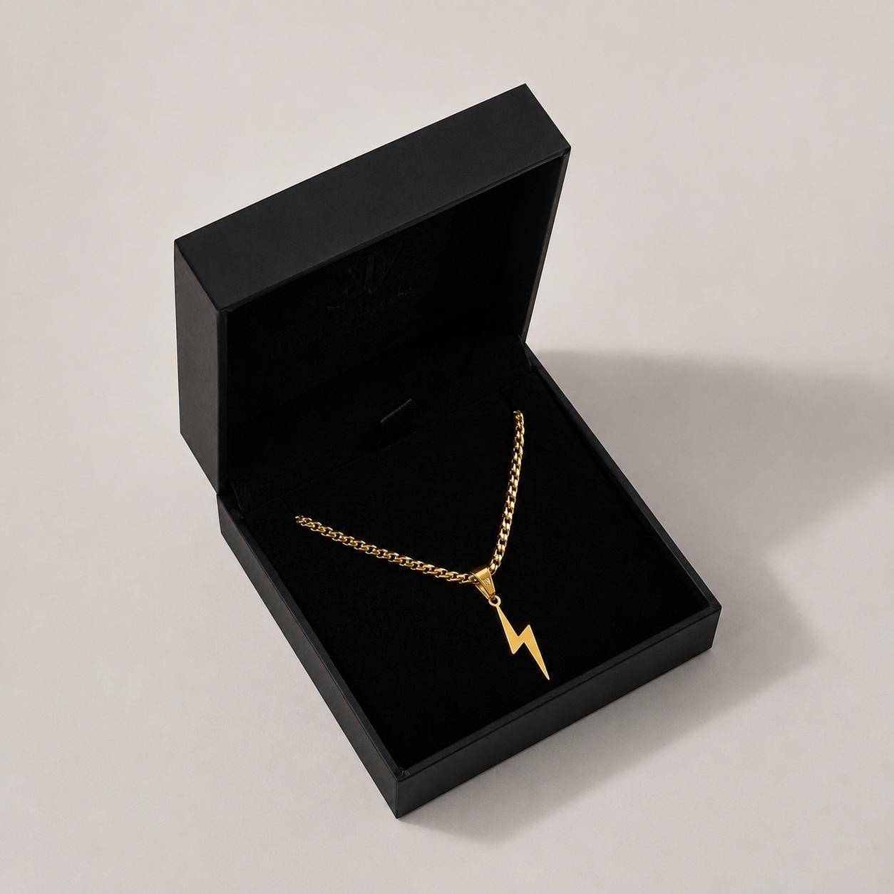 Gold flash lightning bolt pendant on 2.5mm box chain in a black branded gift box, JVillion