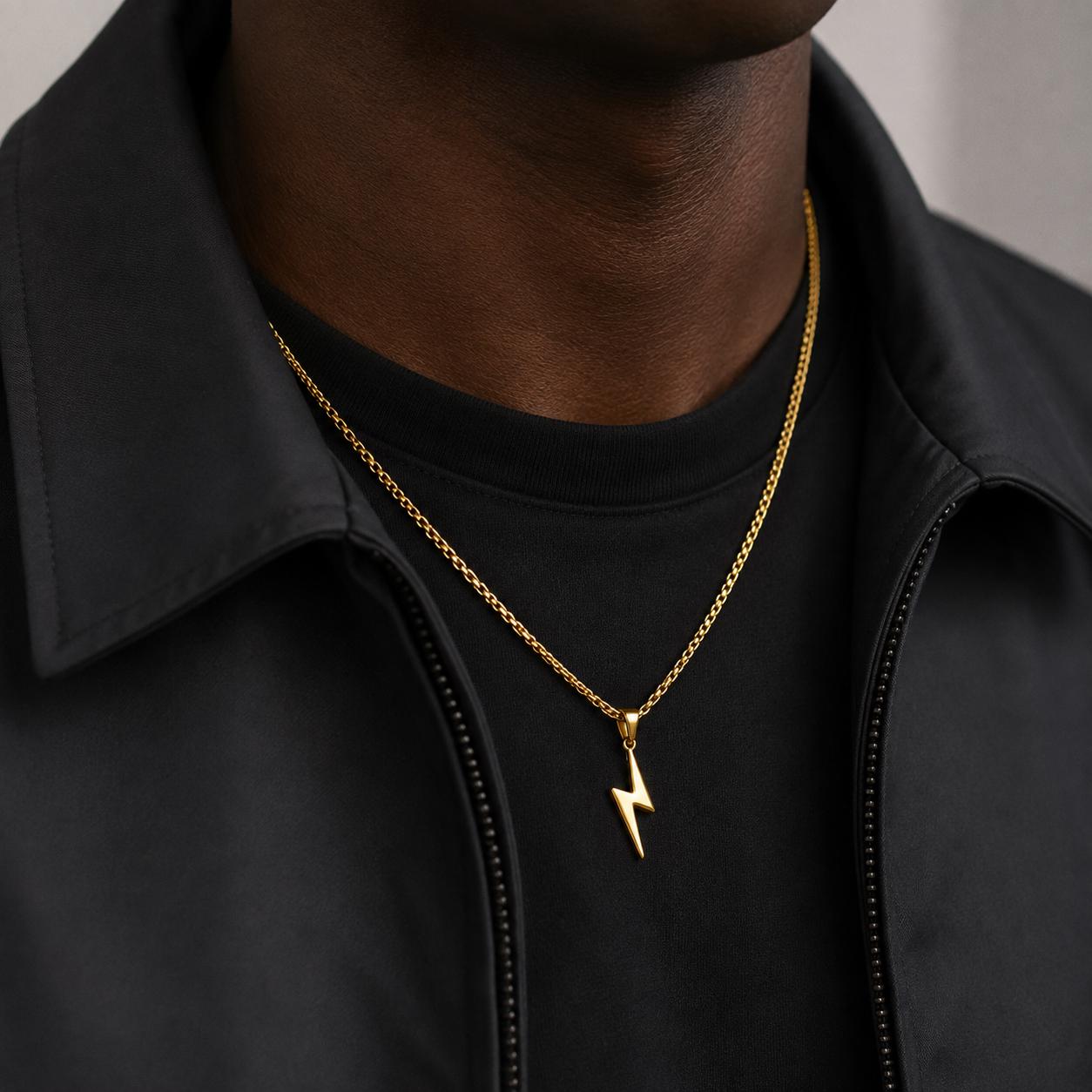 Gold flash lightning bolt pendant on 2.5mm box chain worn by model, JVillion