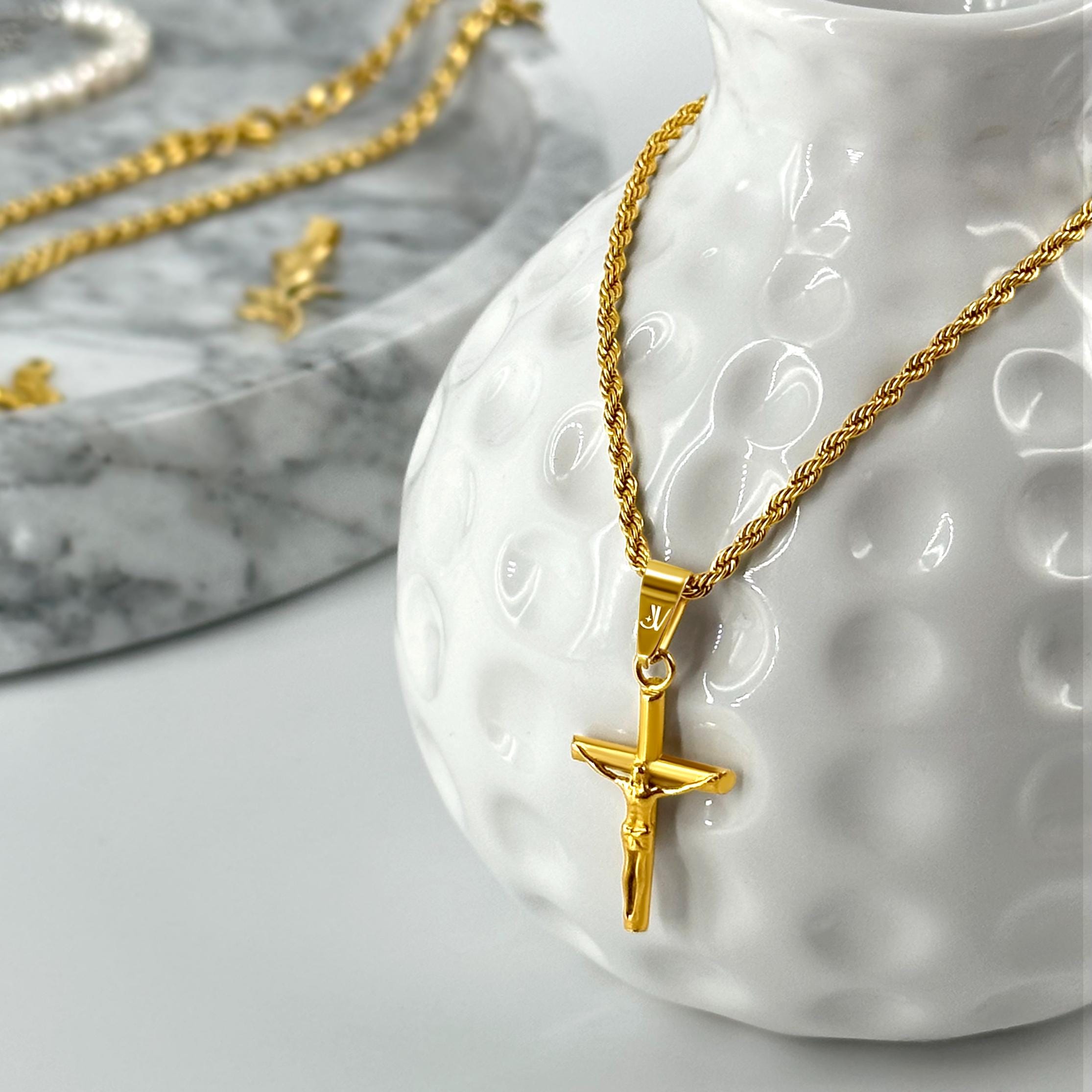 Gold Jesus cross crucifix pendant on 2mm rope chain, styled product scene, JVillion
