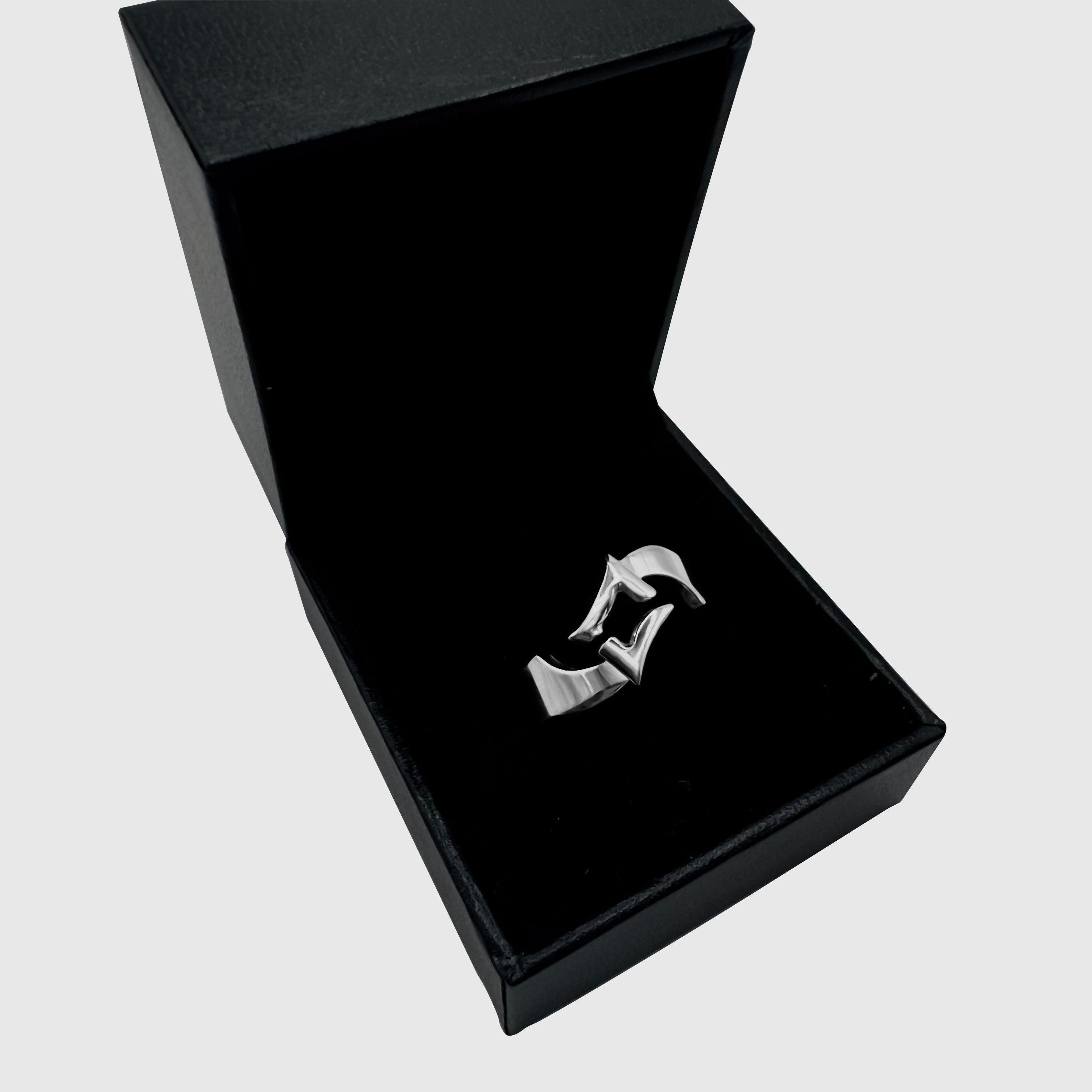 Silver split star ring in a black JVillion gift case