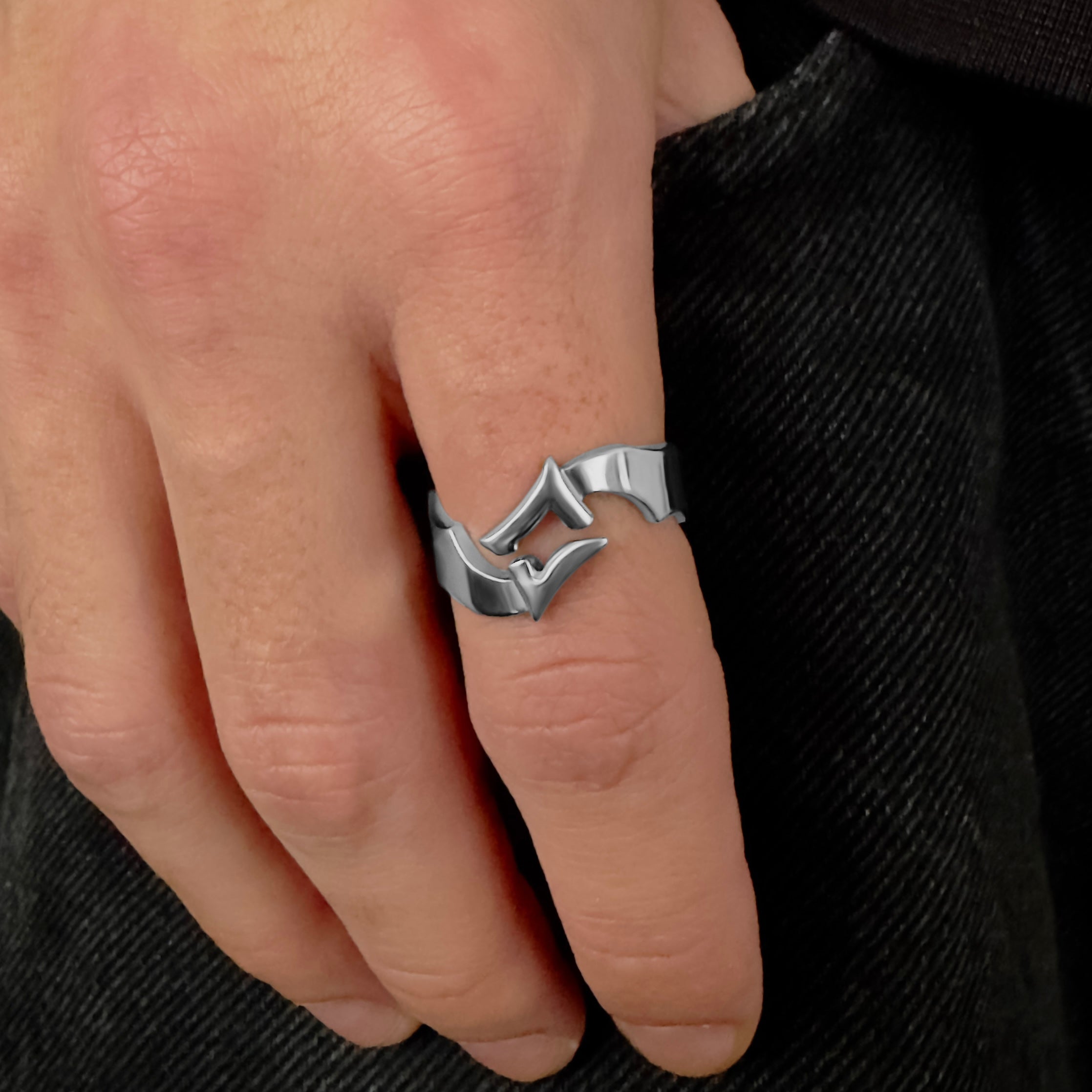 Split star silver ring worn on hand – modern celestial accessory