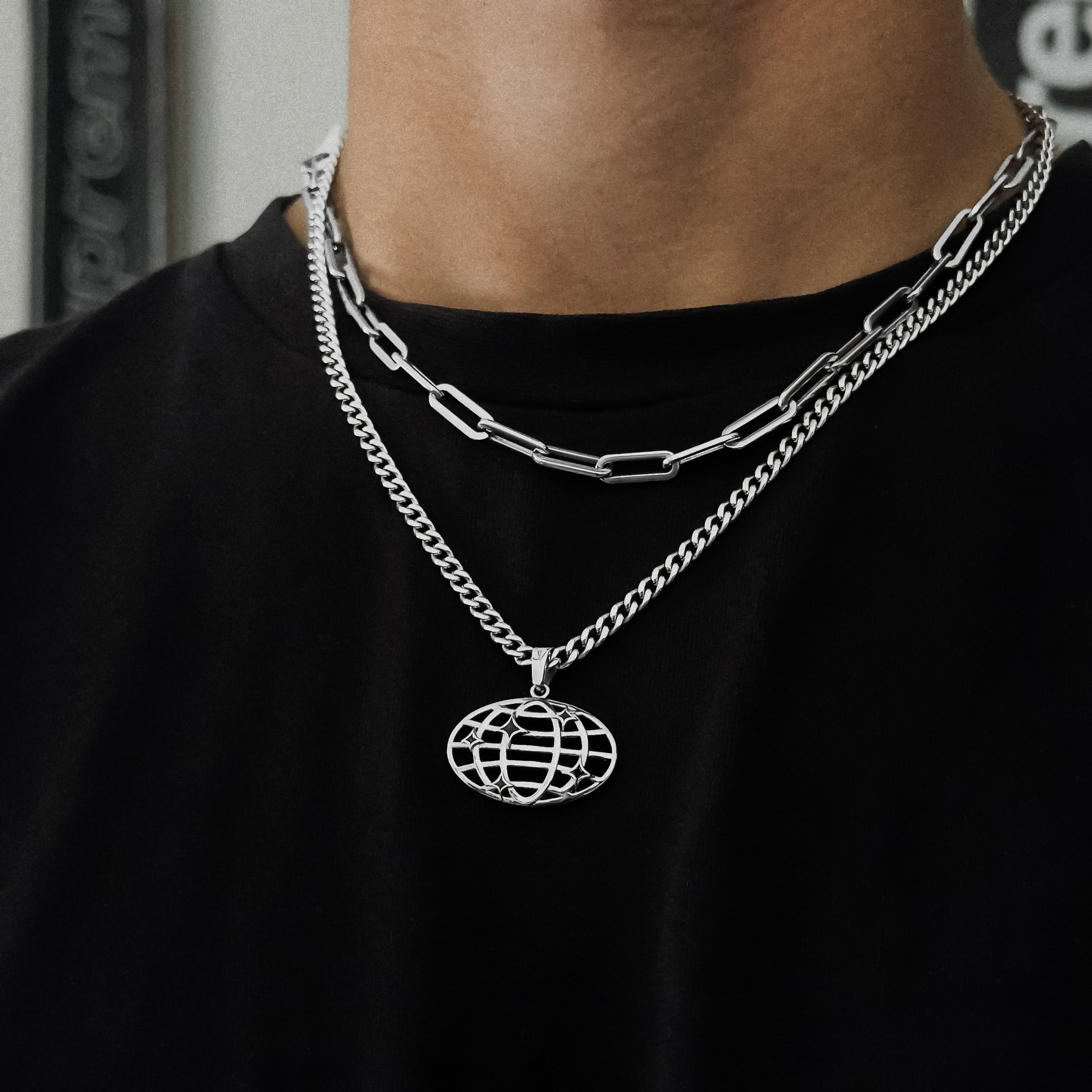Macro Shot of World Pendant Stainless Steel Necklace
